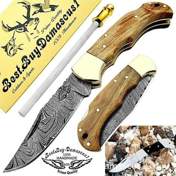 Damascus folding knife with olive wood handle and brass bolster — open and closed views with a honing rod and brand card — cover image for the engraved pocket knife gift guide